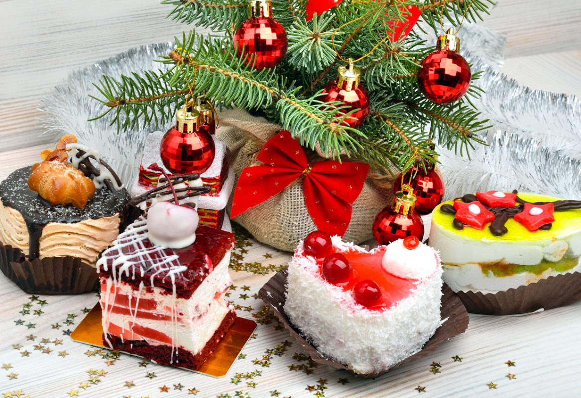 Christmas delicious cakes on christmas background, christmas balls, pine twig.