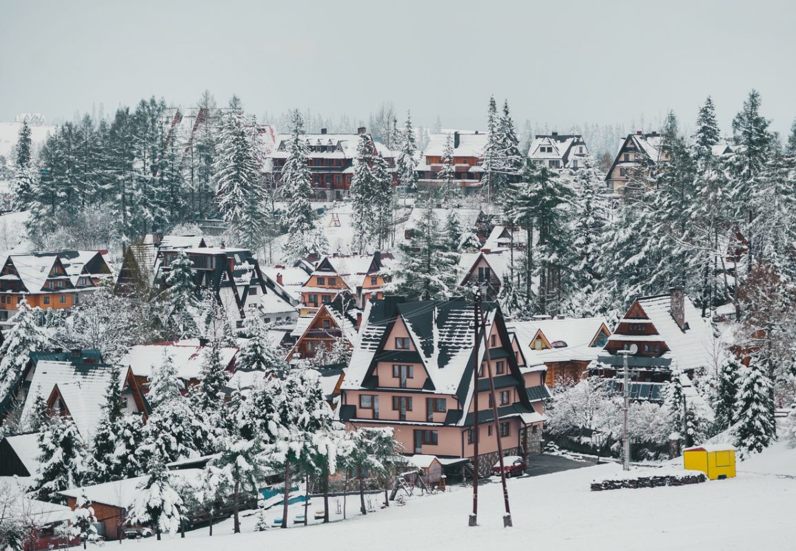 Tatra mountain landscape of zakopane with wooden cottages. Panoramic beautiful winter inspirational landscape view.