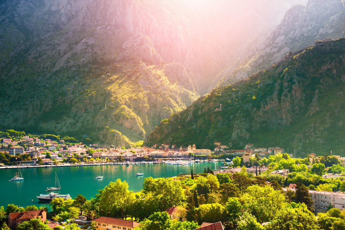 Panoramic view of Kotor town and Kotor bay in Montenegro at sunrise. Summer landscape. Famous travel destination.