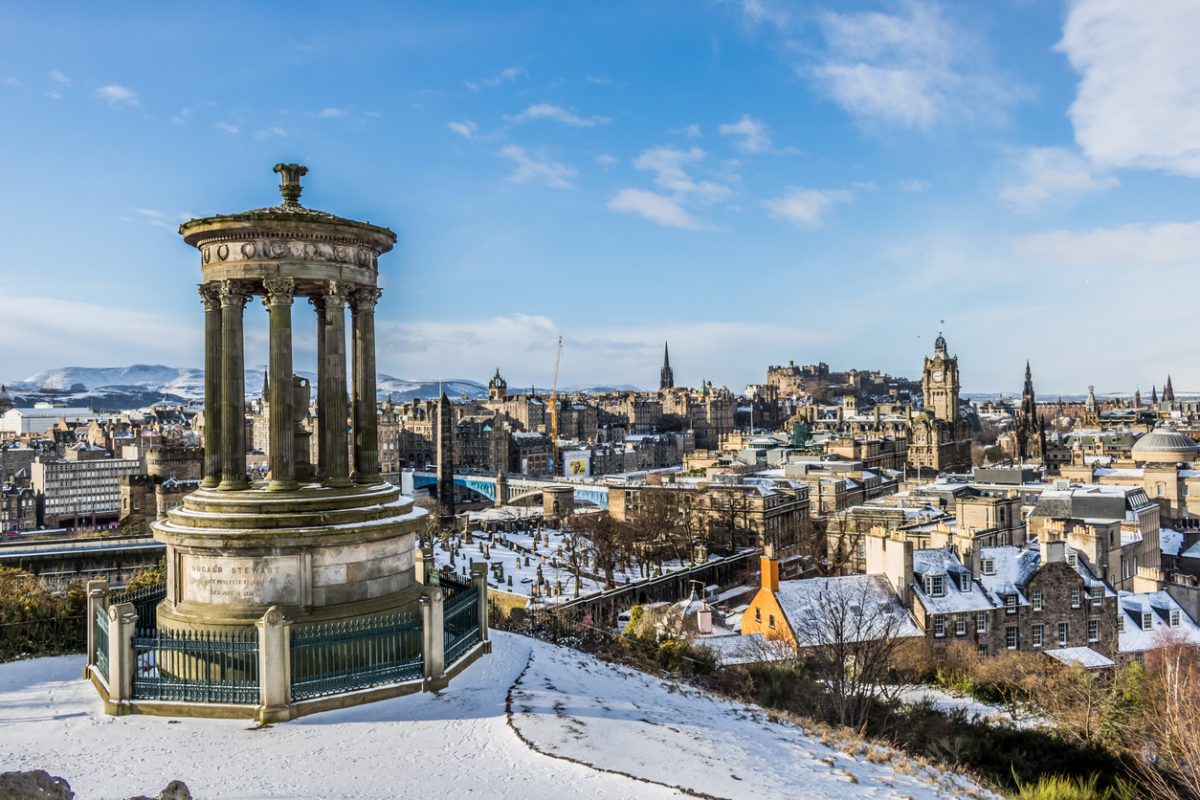 aerial view of Edinburgh with princess street and Edinburgh castle (old town) covered in Snow in Edinburgh, Scotland