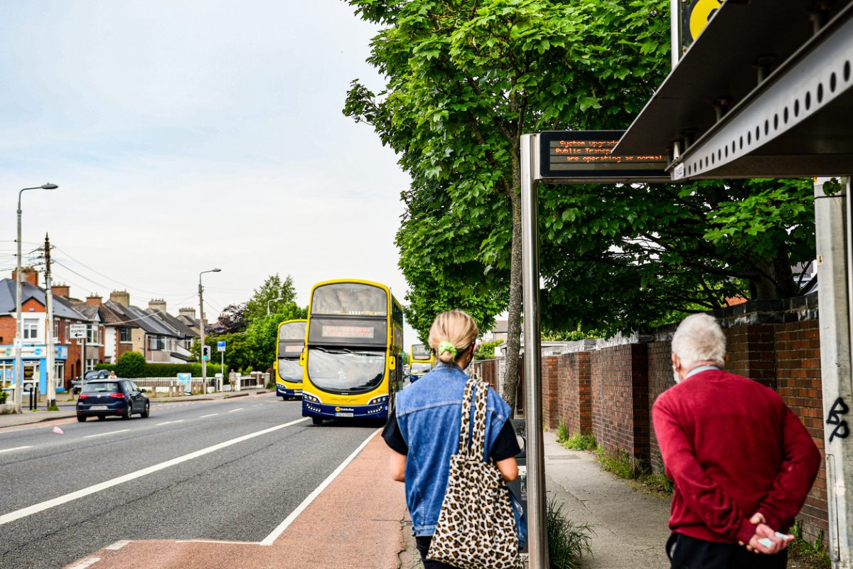Commuters on the Navan Road in Dublin waiting to board a bus bound for the city centre.