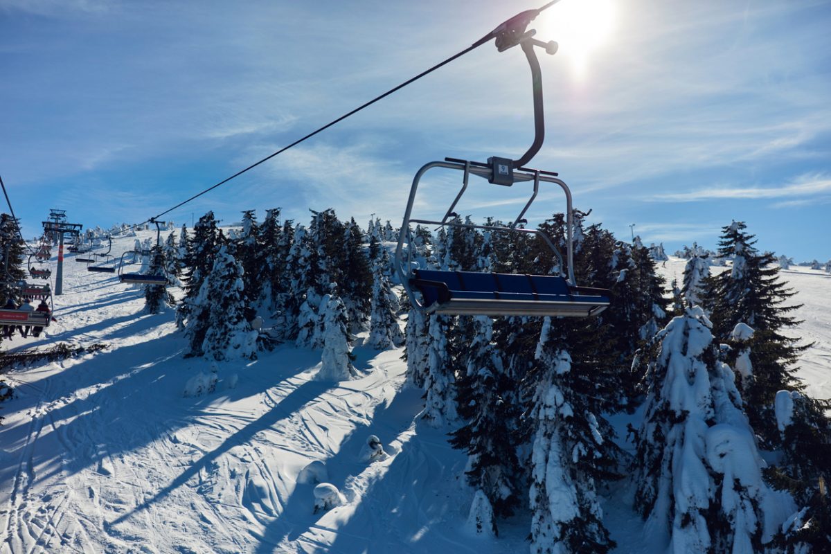 Empty ski chair lift on a mountain - season with no tourists.