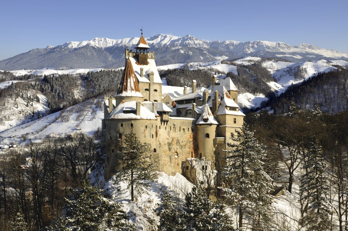 Bran Castle in winter with snow and Bucegi mountains.More pictures with Dracula's Bran Castle in my portfolio !