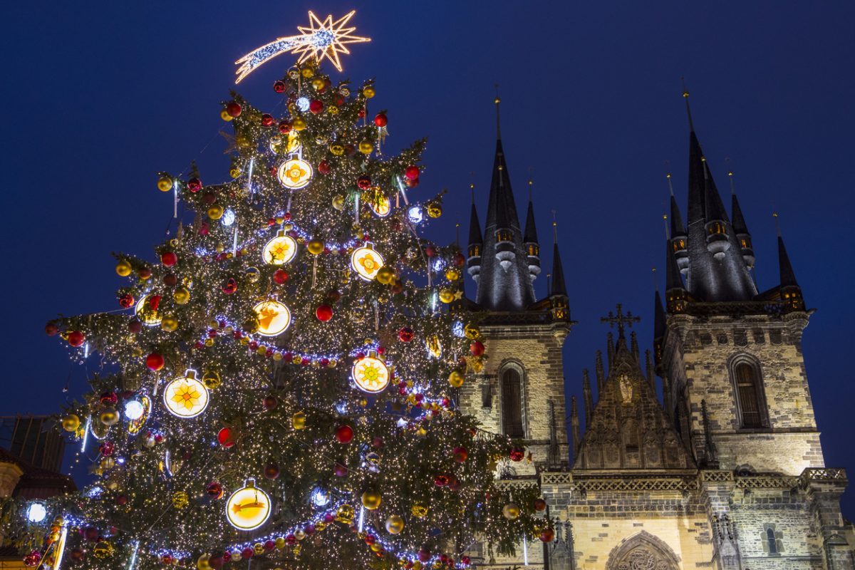 The beautiful Christmas tree and Tyn Church in the Old Town Square in Prague, Czech Republic.