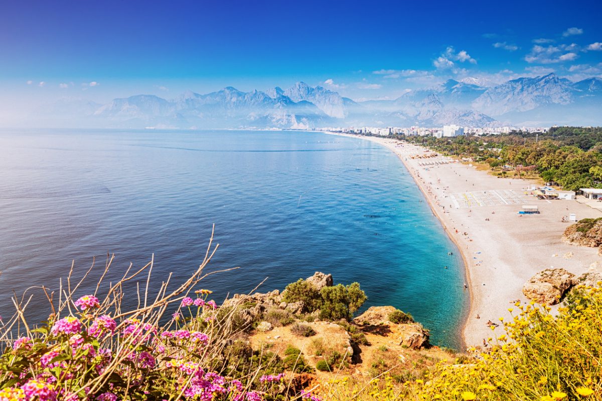 Famous Konyaalti beach, scenic panoramic view from a cliif top. Travel destinations of Turkey and Antalya and mediterranean riviera