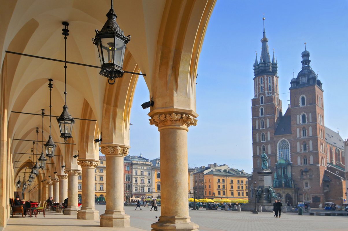 View of Saint Mary's Basilica from Cloth Hall building Sukiennice on main market square of Cracow, Poland.