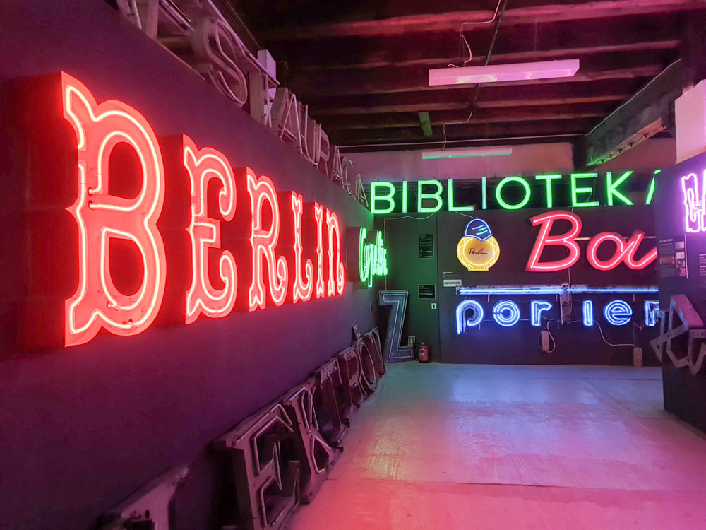 Dazzling Museum of Neon Lights in the Praga district of Warsaw. There are a few signs, a neon red one saying"Berlin" and a neon green one saying "Bibliotek"