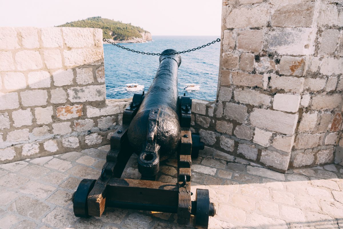 An ancient cannon with kernels on the wall of the old town of Dubrovnik in Croatia