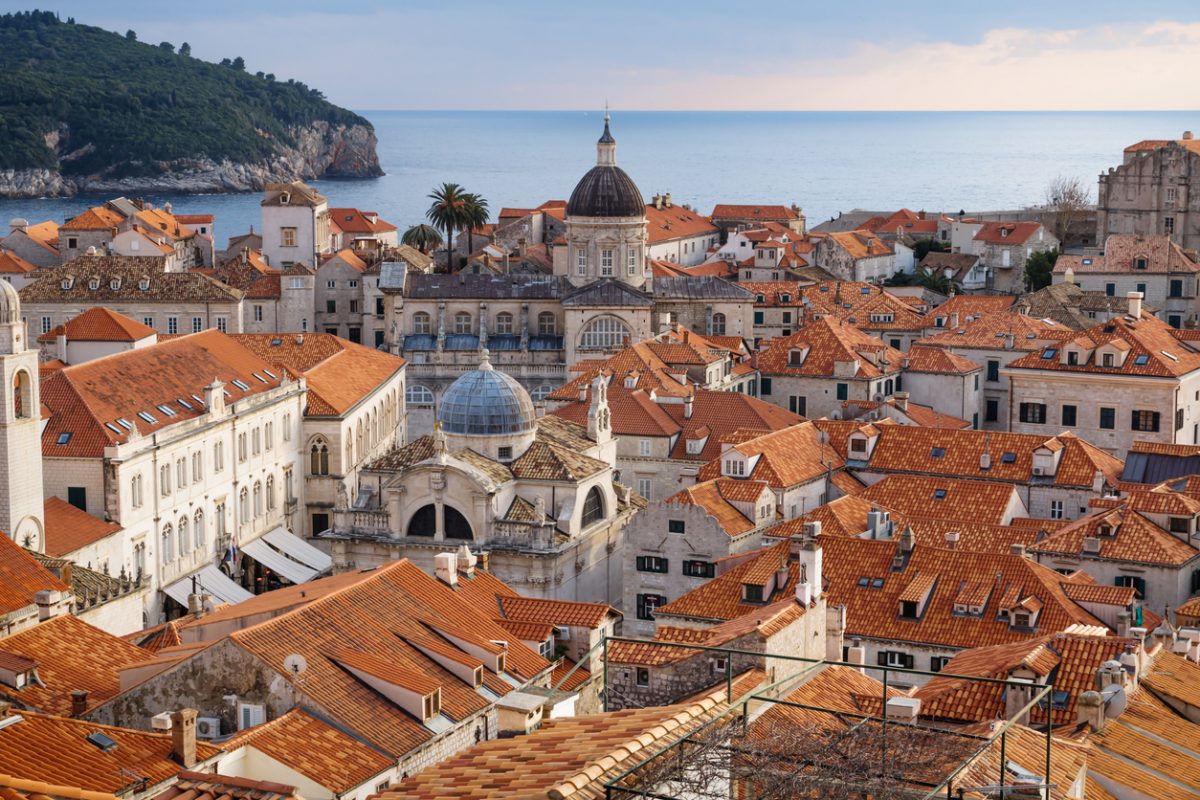 View over the roofs of old town Dubrovnik with church towers, ocean and island in winter, Croatia
