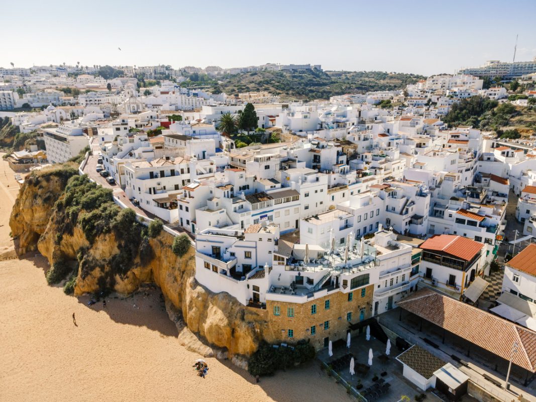 Aerial view of seaside Albufeira with wide beach and white architecture, Algarve, Portugal.