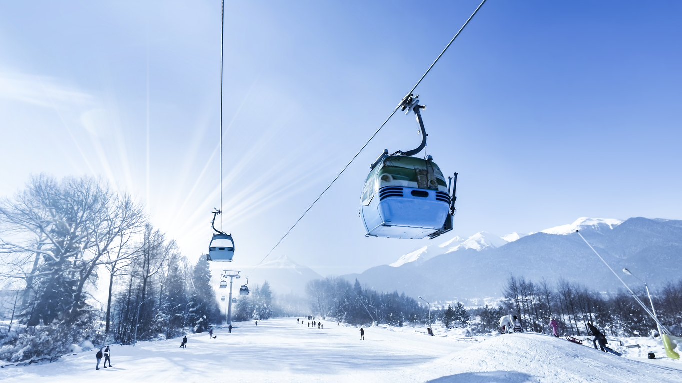 Gondola lift at ski resort in winter. Pirin Mountains. Ropeway station in Bansko