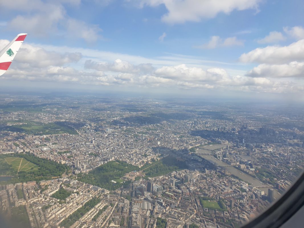 View of London flying high above from an airplane window.