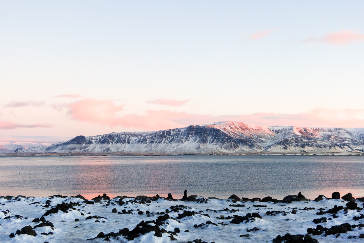 Mountain views with the sunrise in the background on the Sculptures and Shore walk along Reykjavik coastline