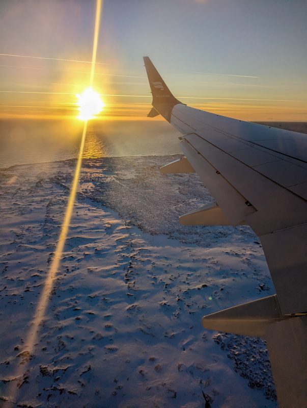 Epic view of the sun setting over a frosty Iceland in the winter