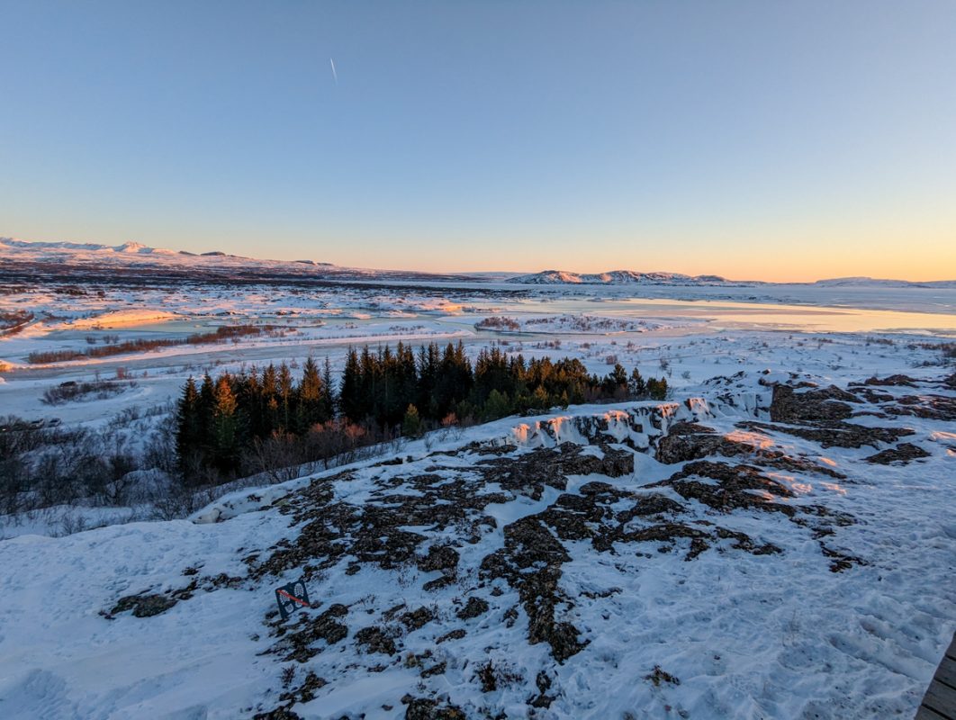 View over the landscape of Thingveller National Park in winter, covered in snow.