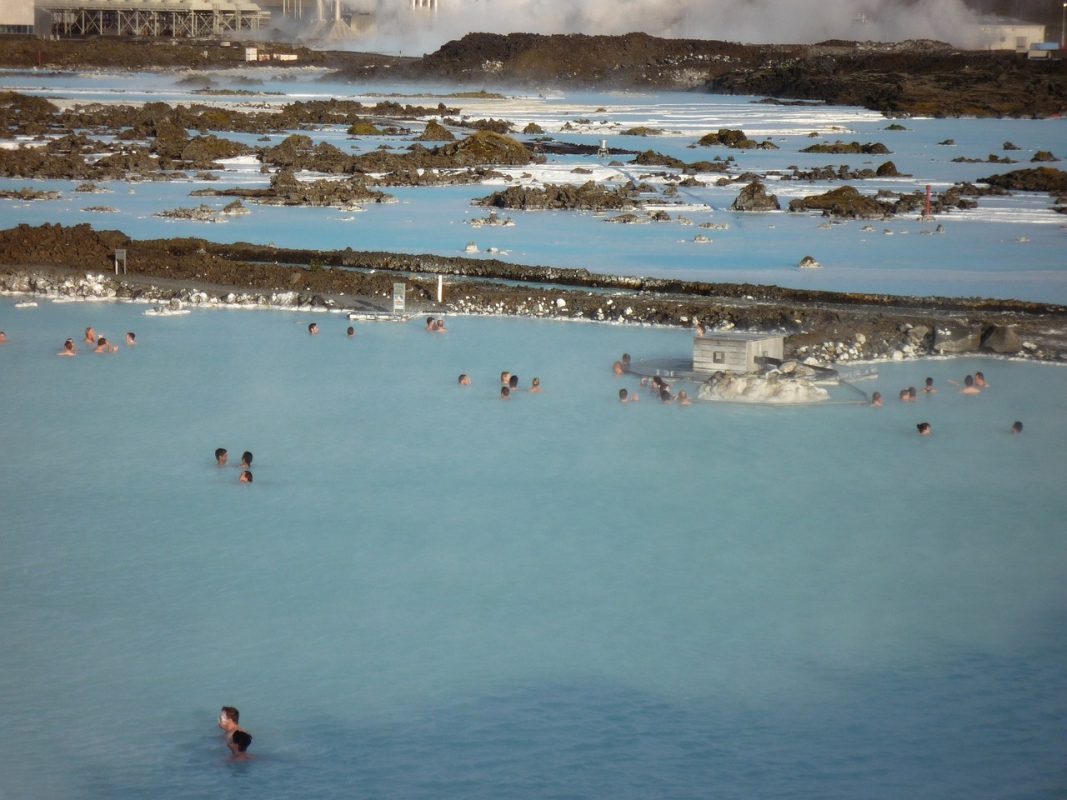 People in the blue lagoon, a bright blue geothermal pool which is one of Iceland's best attractions. 