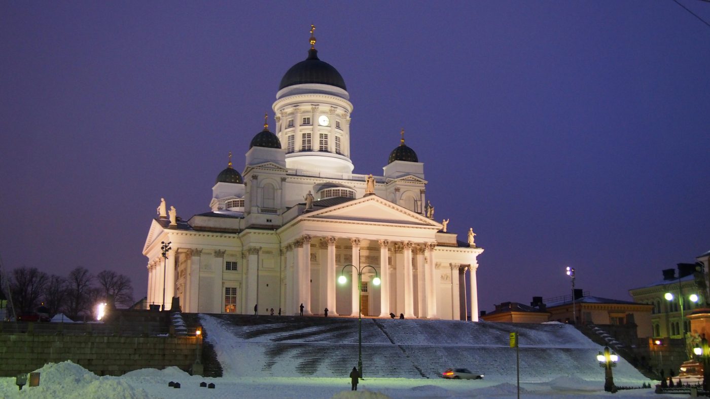 Senate Square in Helsinki, with darkening sky above and snow on the ground.