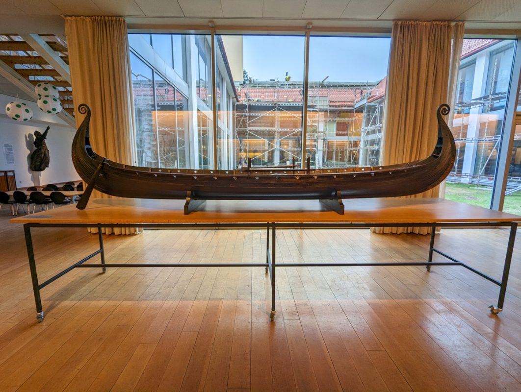 Maritime Museum in Bergen, Norway, with one of the traditional boats in front of a window