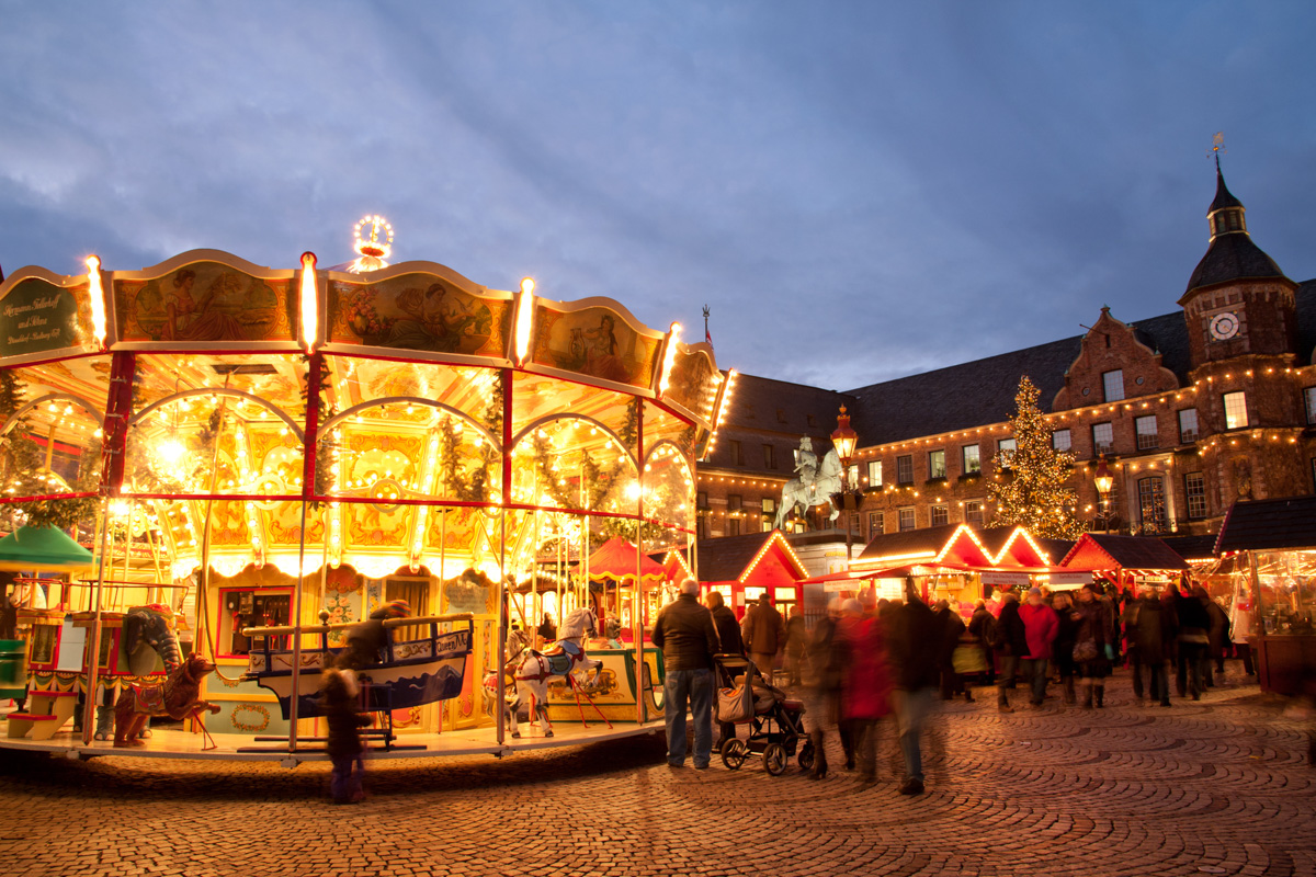Dusseldorf at Christmas, with brightly lit up carousel