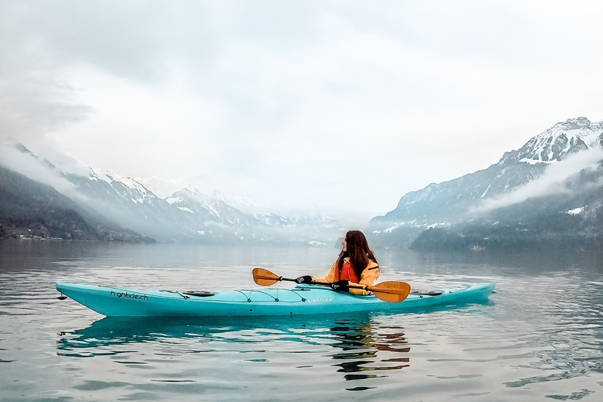 Interlaken in Switzerland, kayaking on the water and surrounded by mountains. 