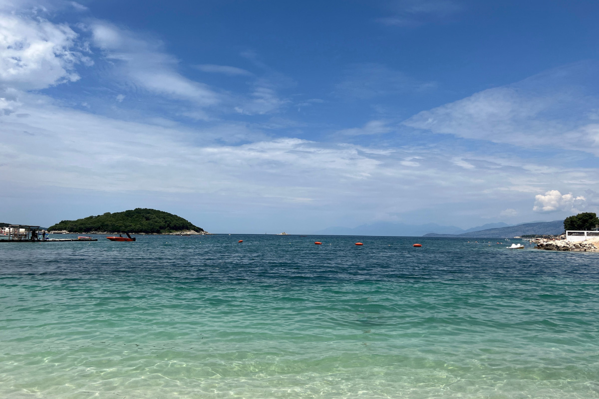 Ksamil, Albania, bright blue water and golden sands 