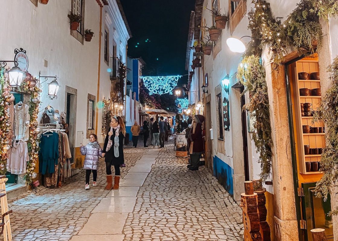 Festive town of Obidos, Portugal, in December, with festive lighting in the streets. 