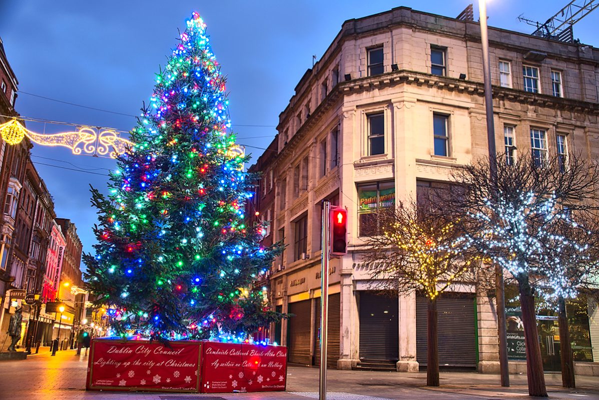 Dublin, Ireland - December 19, 2020: The lights on the O'Connell Street Christmas Tree and on Henry Street in the early morning