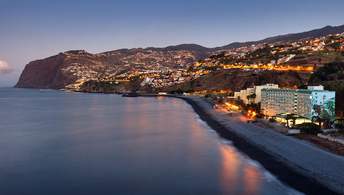 Funchal city at night near Praia Formosa beach, Madeira - Portugal