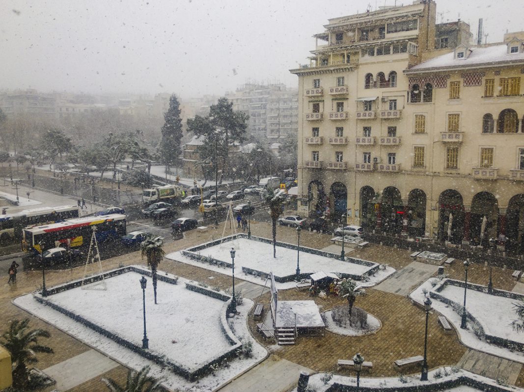 Thessaloniki, Greece - January 04 2019: Heavy snowfall at the city center.Snow and traffic at the city main square, Aristotelous.