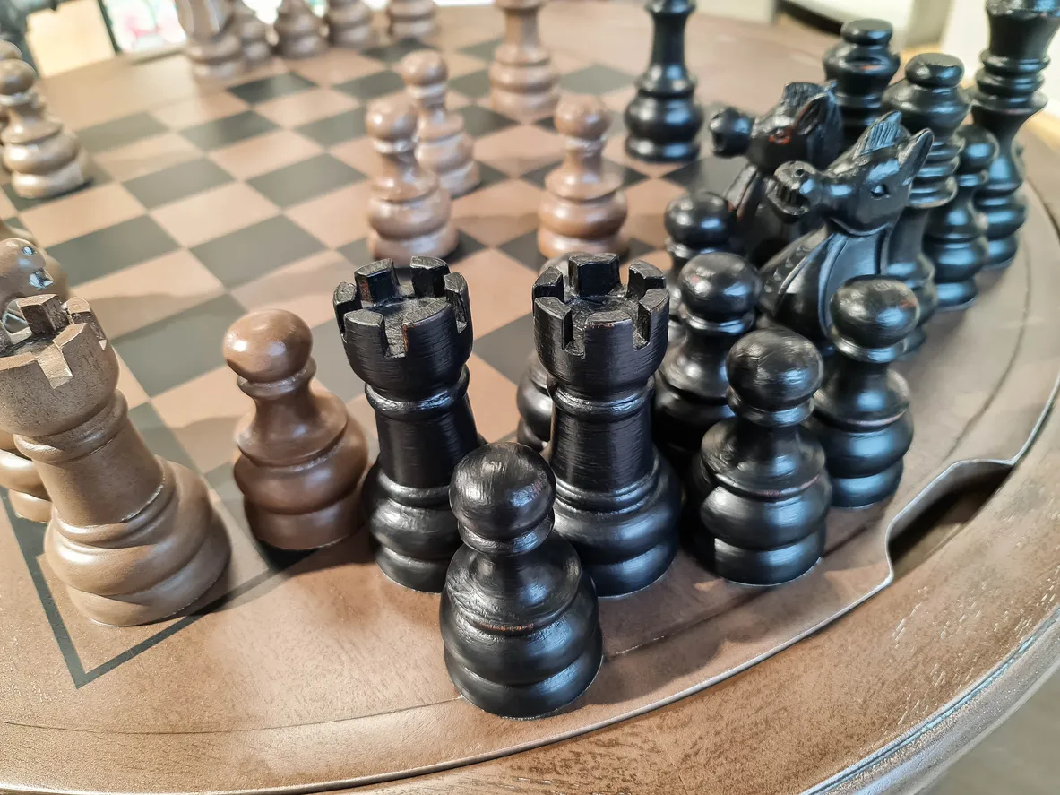 Close up of chess pieces on board game Wooden vintage chess pieces on board game