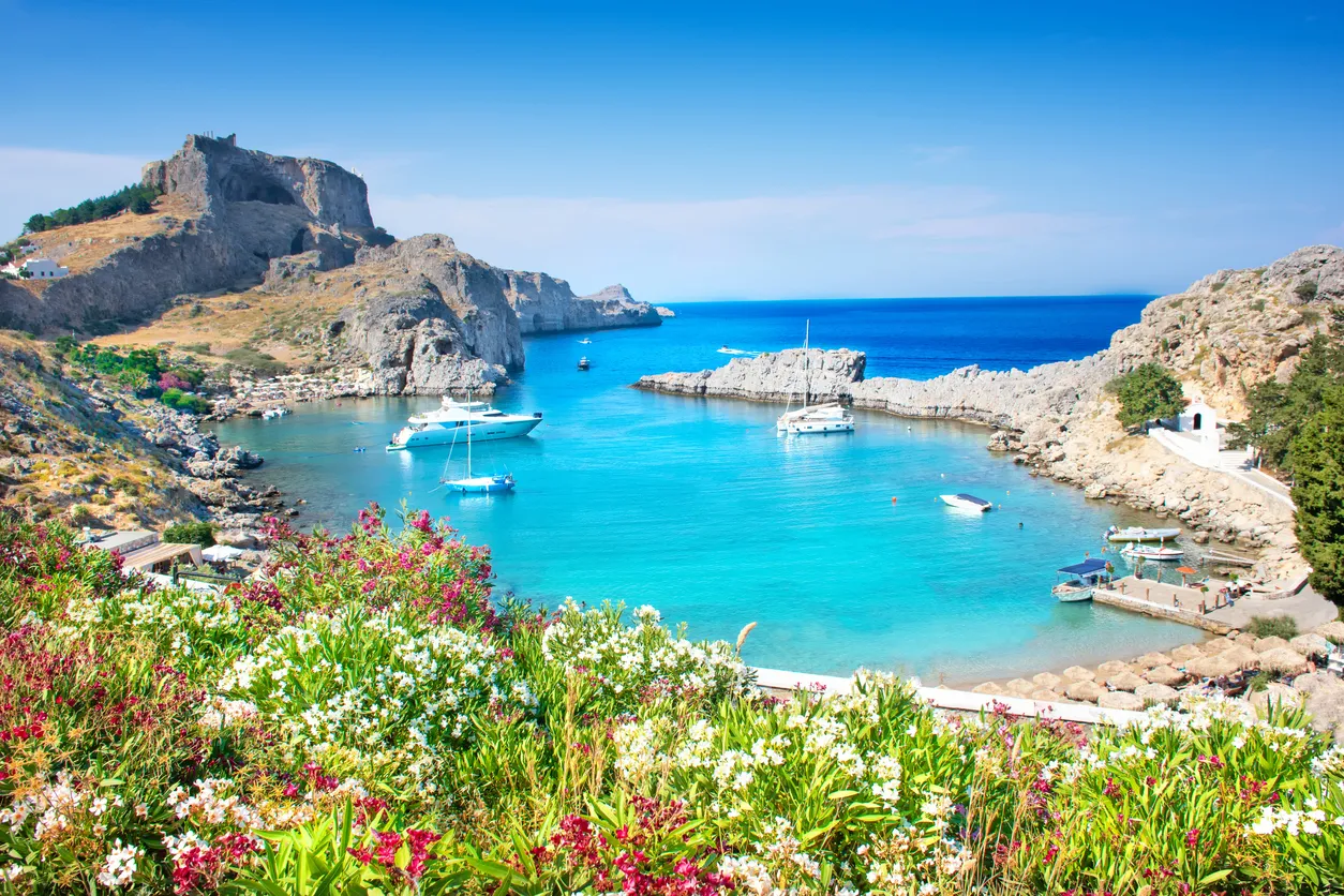 Lindos â panoramic view of St. Paul bay with acropolis of Lindos in background (Rhodes, Greece)