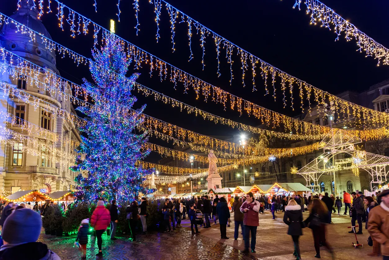 Bucharest, Romania - December 23, 2015: People Gather At The Christmas Market Downtown Bucharest City At Night In The University Square.