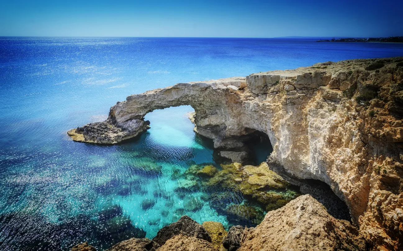 Beautiful natural rock arch near of Ayia Napa, Cavo Greco and Protaras on Cyprus island, Mediterranean Sea. Legendary bridge lovers.