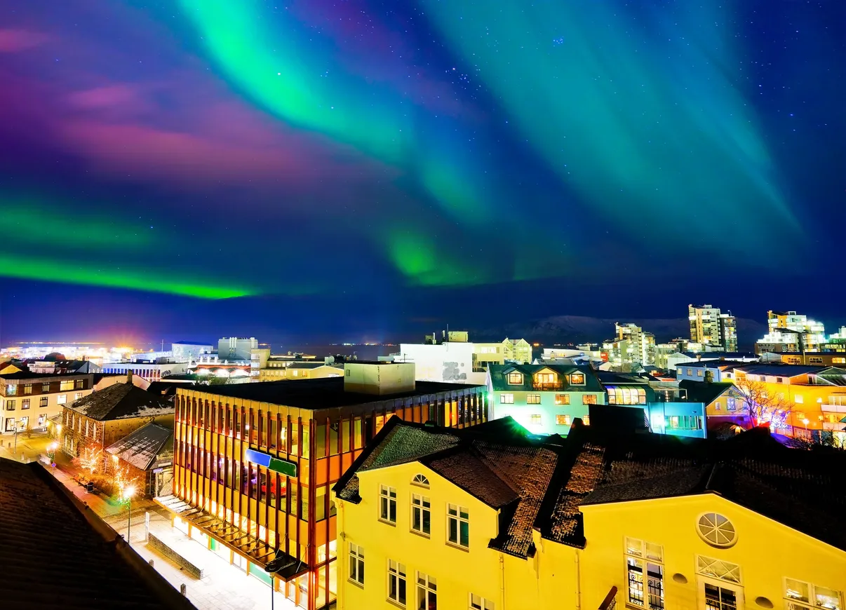 View of the northern light from the city center in Reykjavik, Iceland.