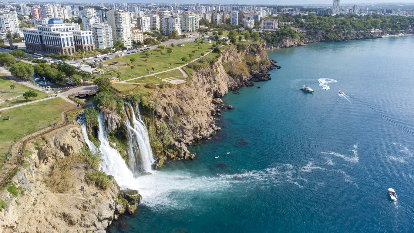 Waterfall Duden (Karpuzkaldiran selalesi) falling into the Mediterranean sea. Waterfall falling into sea. Waterfall stream. Aerial drone shooting. Antalya - Turkey