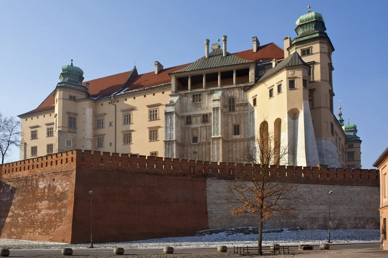 Krakow, Poland - January 30, 2012: Royal Castle buildings on Wawel Hill in the city of Krakow in Poland. Together the Wawel Royal Castle and the Wawel Hill constitute the most historically and culturally important site in Poland. For centuries the residence of the kings of Poland and the symbol of Polish statehood, the Castle is now one of the country’s premier art museums. Built for Casimir III the Great, who reigned from 1333 to 1370.