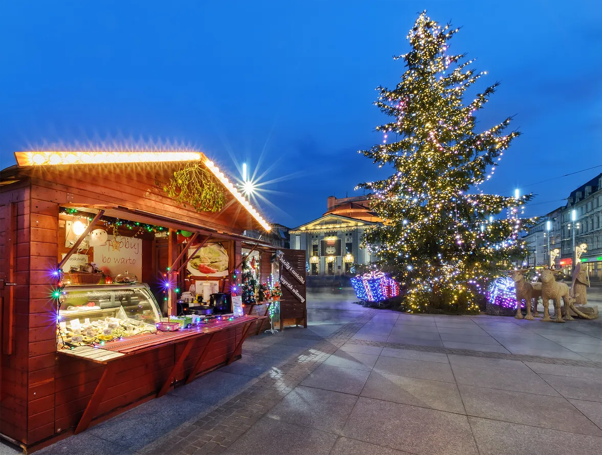 Katowice, Poland - December 11, 2015: Traditional street market and Christmas tree in main squere of Katowice. Katowice is a city in southwestern Poland, with a population of 304,362 as of 2013.