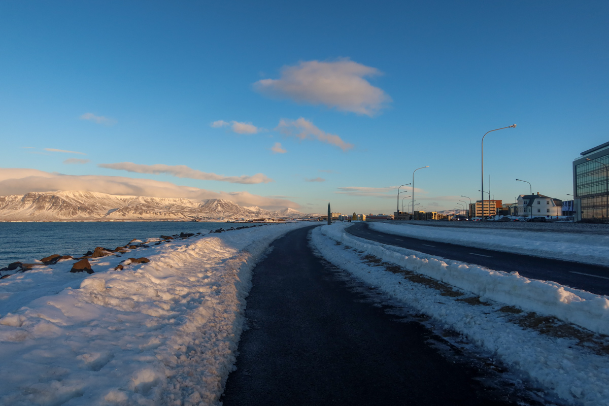 The coastline of Reykjavik with snow on either side.