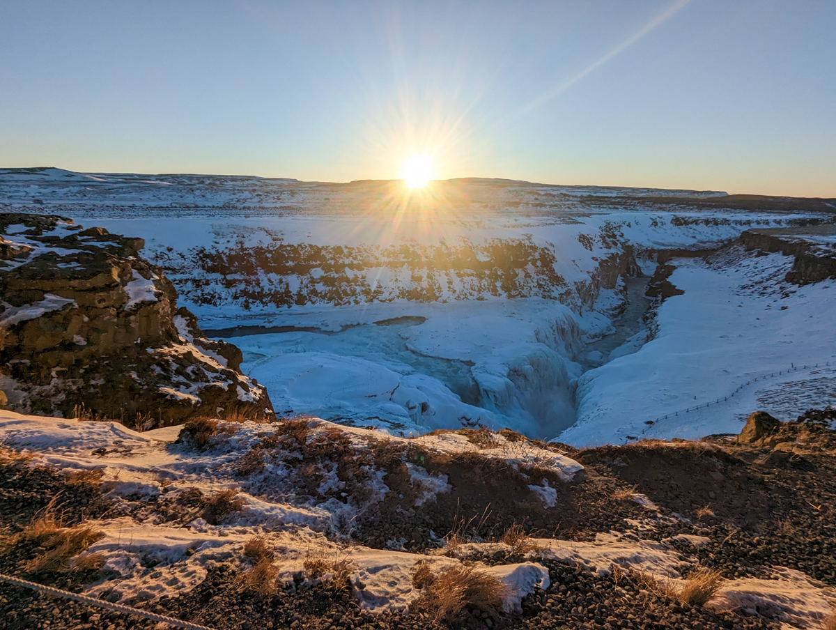 Sun rising over Gullfoss Falls in winter.