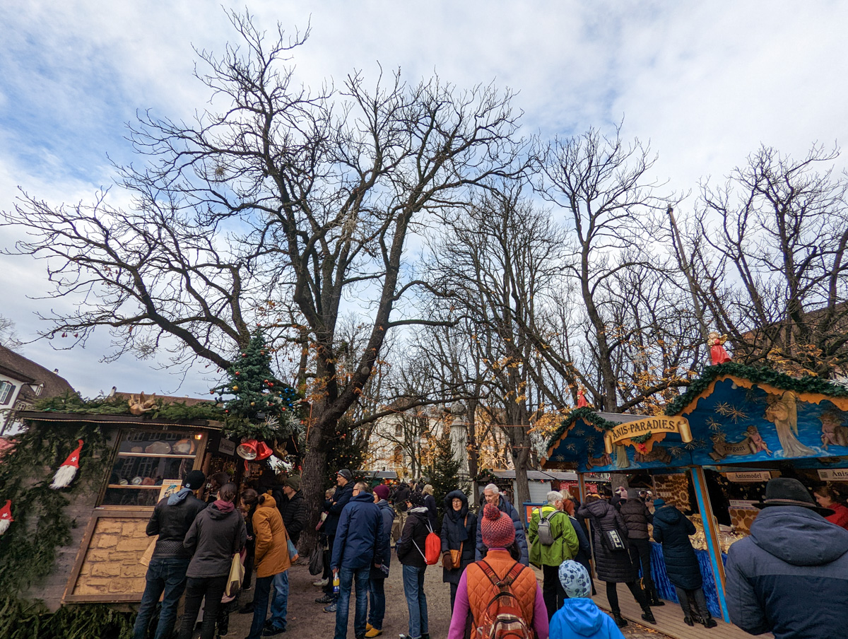 Basel Christmas Market, with festive huts on either side.