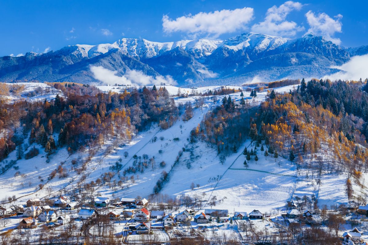 Winter in Moeciu Village. Rural landscape in the Carpathians, Romania.