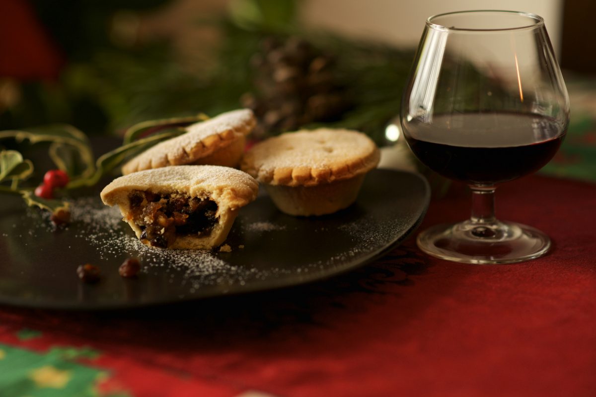 traditional sweet mince pie and mulled wine glass