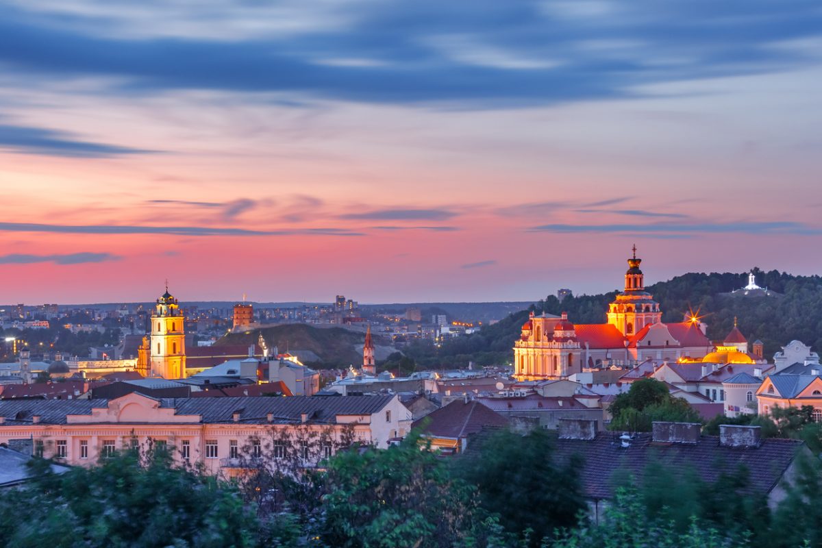Aerial view over Old town with Gediminas Castle Tower, churches and Three Crosses on the Bleak Hill at sunrise, Vilnius, Lithuania, Baltic states.