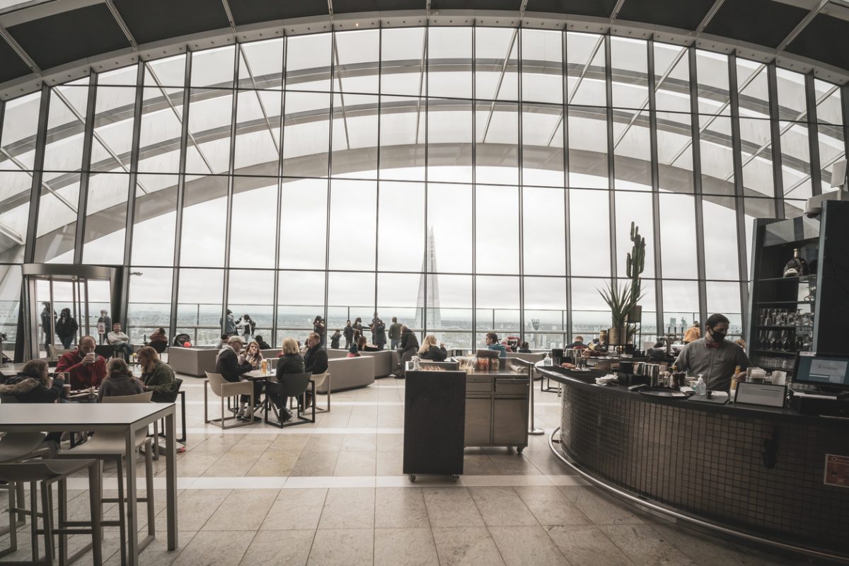 Walkie Talkie Building, London UK - October 29th 2020 - Inside the top floor sky garden contemporary rooftop restaurant with tourists eating drinking and dining