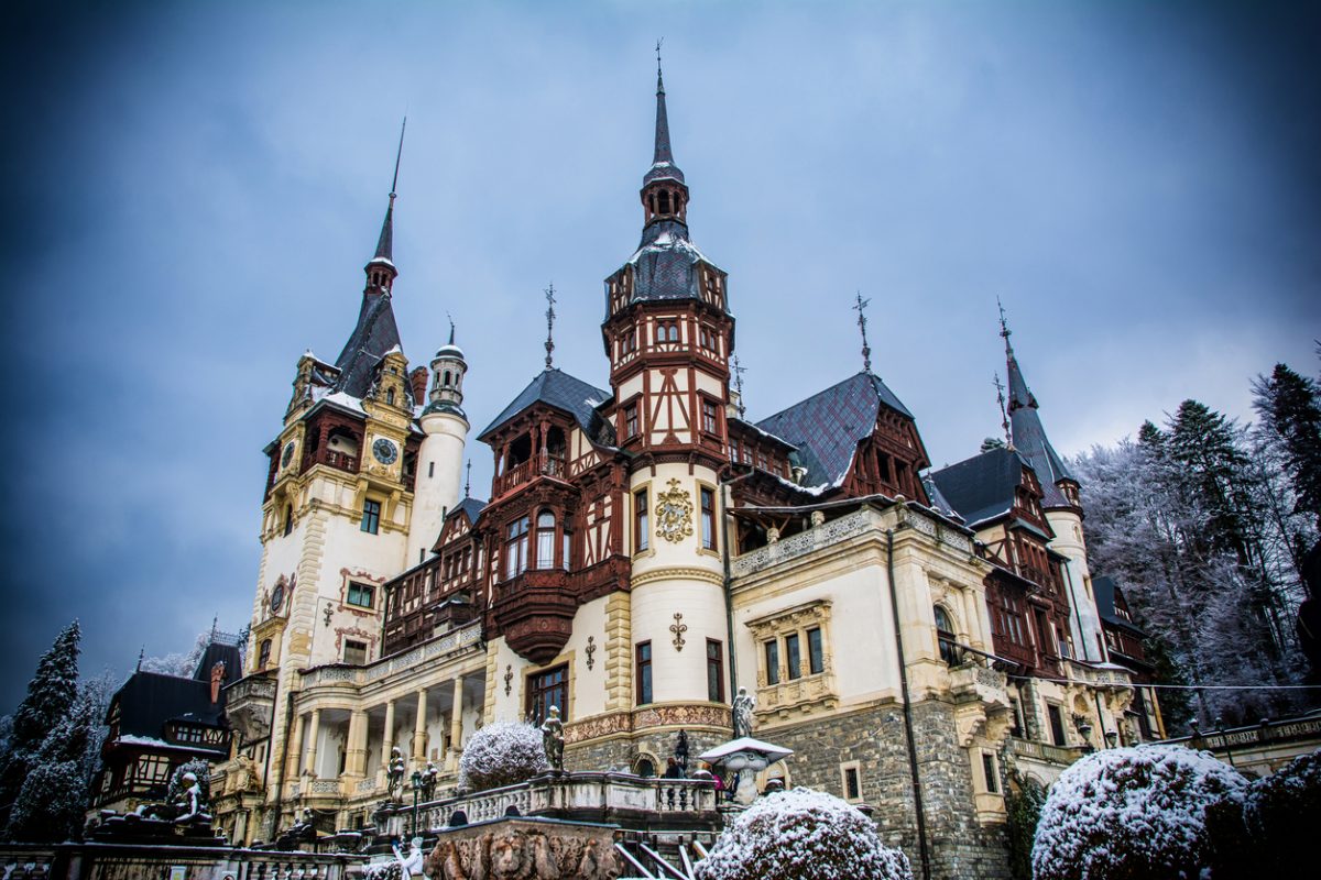 Stock photo Of Peles Castle Located In Sinaia, Romania. Snowy Palace In Europe. Travels And Tourism