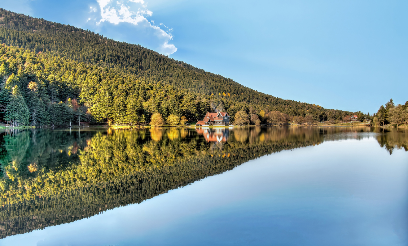 Panoramic view of Abant Lake with a wooden lake house in Abant, Golcuk, Bolu, Turkey