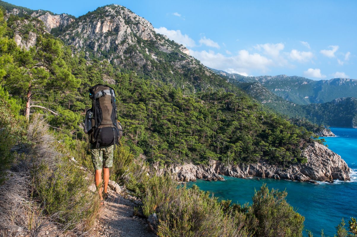 Hiking in Turkey. Lycian Way. Backpacker by the sea. The track is completed