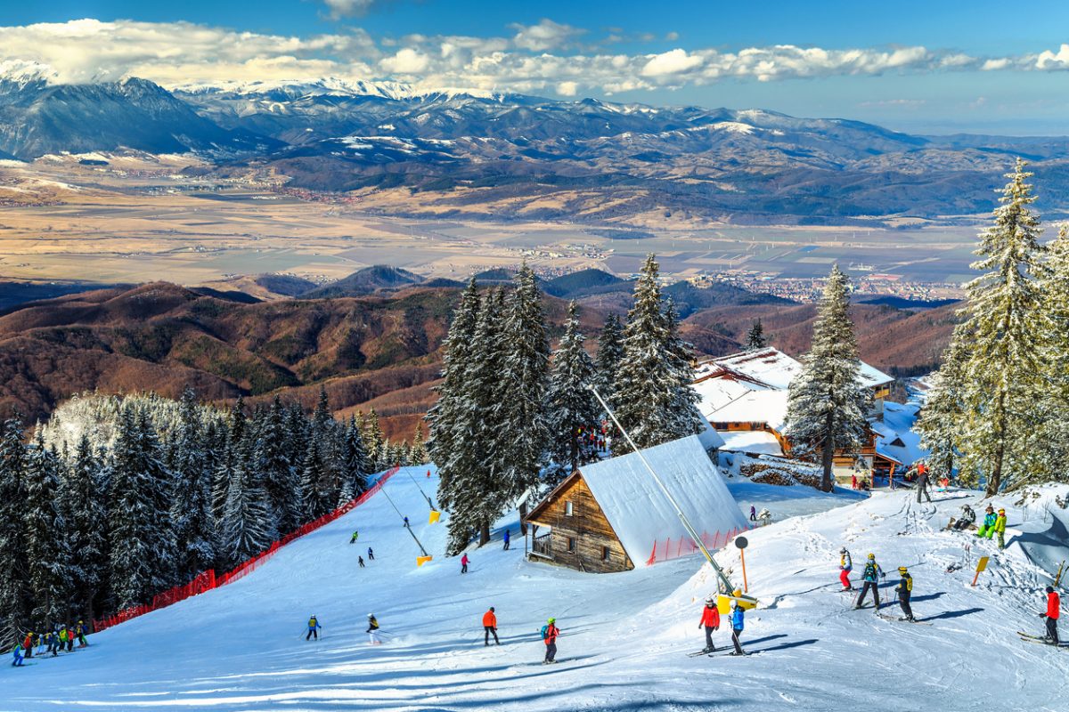 Wooden chalets and spectacular ski slopes in the Carpathians,Poiana Brasov ski resort,Transylvania,Romania,Europe