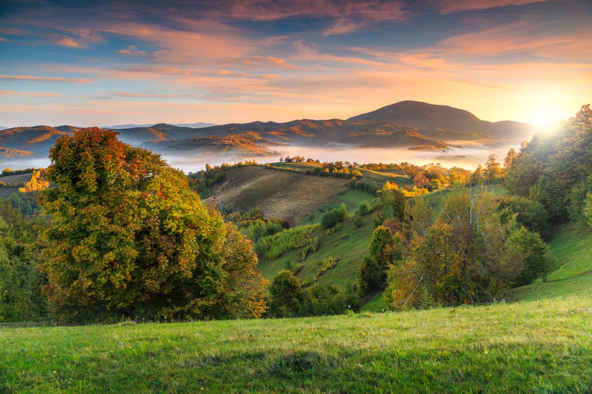 Stunning autumn nature with misty landscape,Holbav village,Carpathians,Transylvania,Romania,Europe