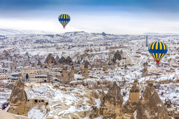 Cappadocia, Turkey - December 16, 2013 : Early morning in Cappadocia, Turkey, hot air balloons offer guests from all over the world spectacular views of the Cappadocian landscape.